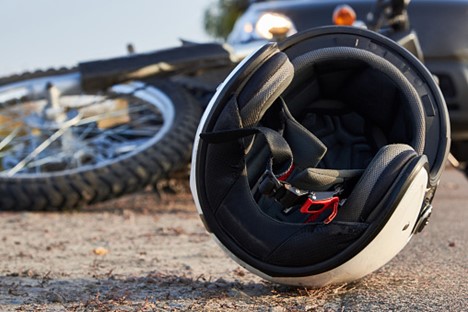 motorcycle and helmet on the ground after a motorcycle wreck in Texas